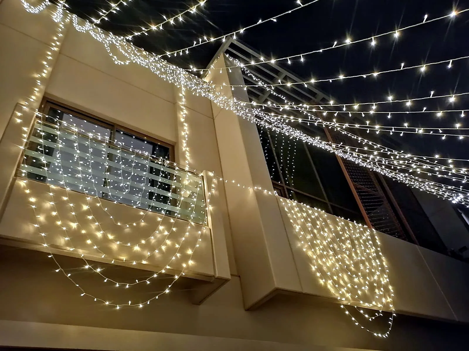 Garden patio string lighting over the lawn